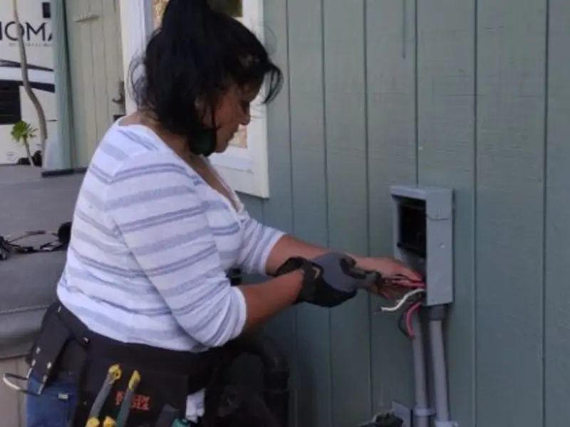 Licensed electrician wiring an exterior subpanel in Shadyside